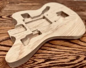 Handcrafted swamp ash single piece electric guitar body made by Fayland Guitars.