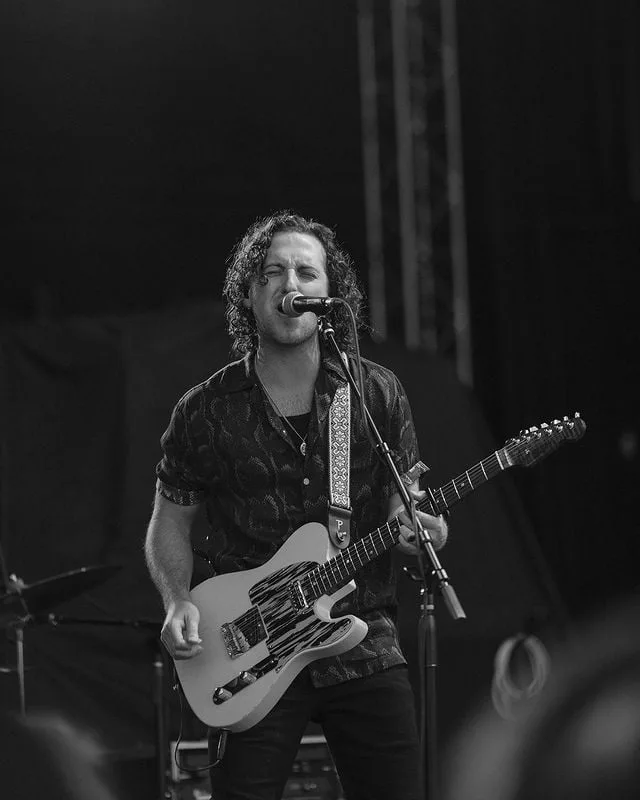 Reid Haughton, artist, playing his custom Fayland Guitars